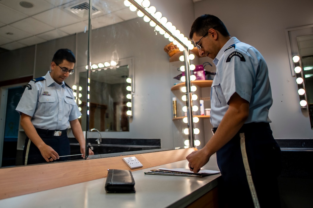 U.S. Air Force 2nd Lt. Nicolas Ayala prepares to conduct a student band during a fine arts festival for the Middle East at the American School of Doha, in Qatar, May 17th, 2025.