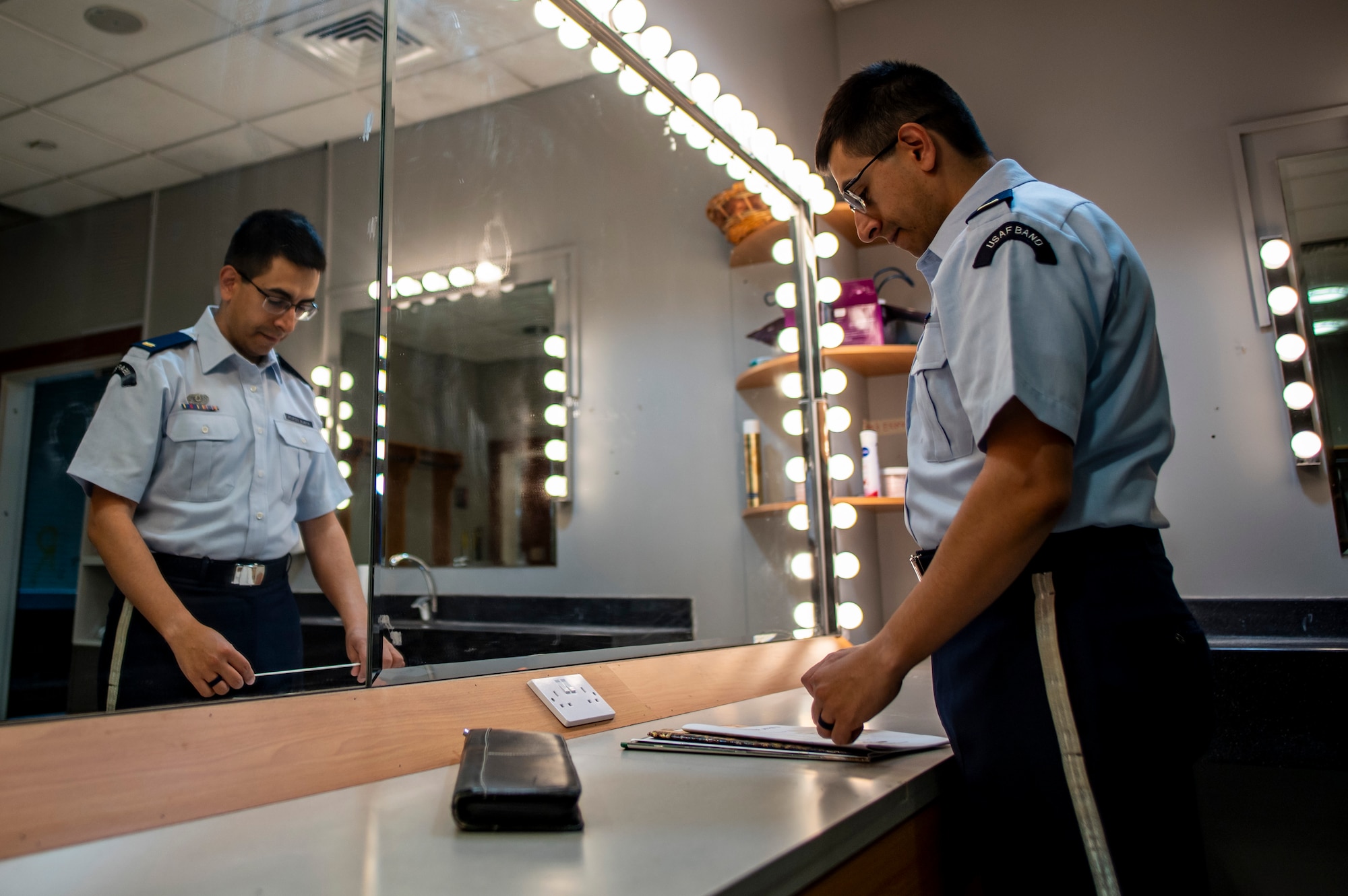 U.S. Air Force 2nd Lt. Nicolas Ayala prepares to conduct a student band during a fine arts festival for the Middle East at the American School of Doha, in Qatar, May 17th, 2025.