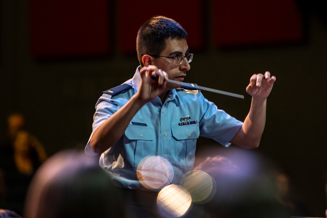 U.S. Air Force 2nd Lt. Nicolas Ayala Ceron conducts a student band during a fine arts festival for the Middle East at the American School of Doha, in Qatar, May 17th, 2025