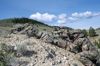 Security Forces Airmen respond to a simulated attack during a field training exercise at Ft. William Henry Harrison, Helena, Mont., June 4, 2025. Security Forces Squadrons from Arizona and Pennsylvania traveled to the Fort for a week of field training. The field instruction consisted of patrol movements, base security, key leader engagements, chemical, biological, radiological, nuclear and explosives detection response, and simulated attacks from opposition forces. (U.S. Air National Guard photo by Master Sgt. Michael Matkin)