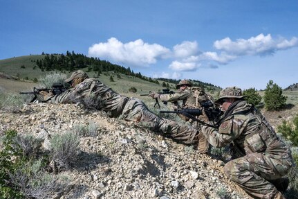 Security Forces Airmen respond to a simulated attack during a field training exercise at Ft. William Henry Harrison, Helena, Mont., June 4, 2025. Security Forces Squadrons from Arizona and Pennsylvania traveled to the Fort for a week of field training. The field instruction consisted of patrol movements, base security, key leader engagements, chemical, biological, radiological, nuclear and explosives detection response, and simulated attacks from opposition forces. (U.S. Air National Guard photo by Master Sgt. Michael Matkin)