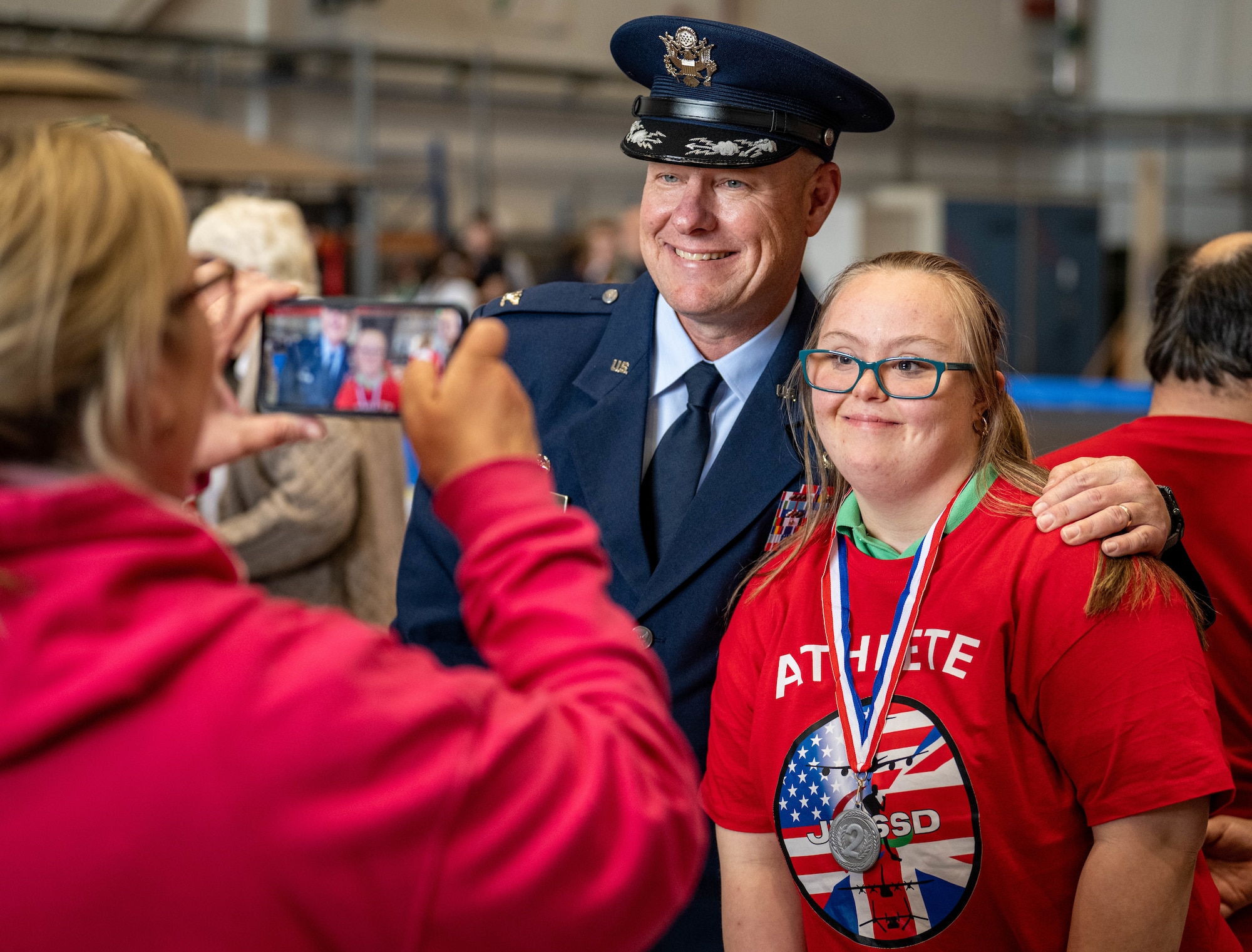 U.S. Air Force Col. Scott Metzler, left, 100th Mission Support Group commander, poses for a photo with an athlete during the Joan Mann Special Sports Day at RAF Mildenhall, England, June 5, 2025.