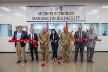 Photo of representatives from the depot workforce and Army leadership cutting the ribbon