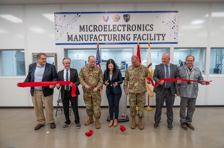 Photo of representatives from the depot workforce and Army leadership cutting the ribbon