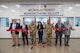 Photo of representatives from the depot workforce and Army leadership cutting the ribbon