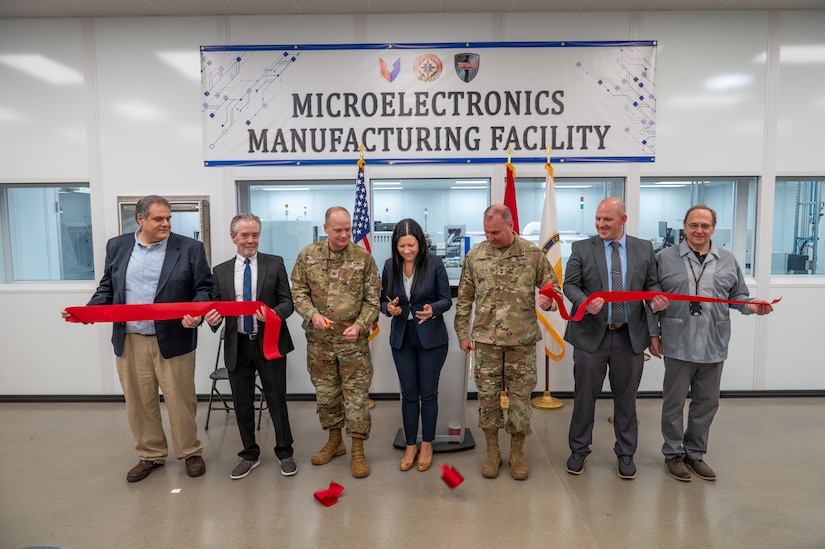 Photo of representatives from the depot workforce and Army leadership cutting the ribbon