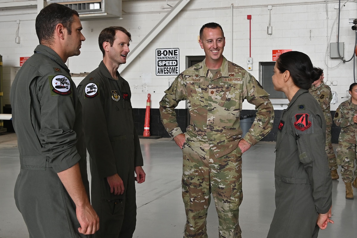 Major Ryan Yeager greets his constituents at an Assumption of Command ceremony.