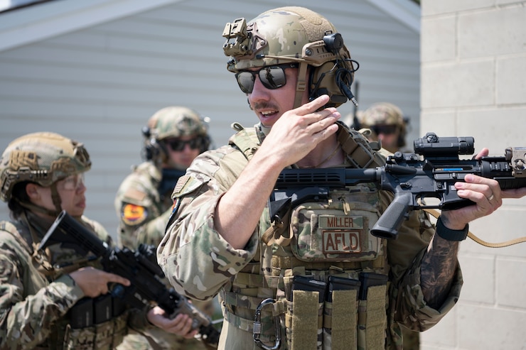 U.S. Air Force Staff Sgt. Alexander Garay, a security forces journeyman assigned to the 156th Security Operations Squadron, Puerto Rico Air National Guard, instructs Airmen with the 156th Contingency Response Group, and the 182nd Airlift Wing, Illinois Air National Guard, in a shoot, move, communicate & close quarters battle training during exercise Sentry North at Alpena Combat Readiness Training Center, Michigan, June 6, 2025. Sentry North 2025 focused on operating in a contested environment with adversary aircraft, electronic jamming, and simulated surface-to-air threats, providing a premier joint training opportunity to ensure participating units are combat-ready and interoperable in operationally limited environments. (U.S. Air National Guard photo by Master Sgt. Rafael D. Rosa)