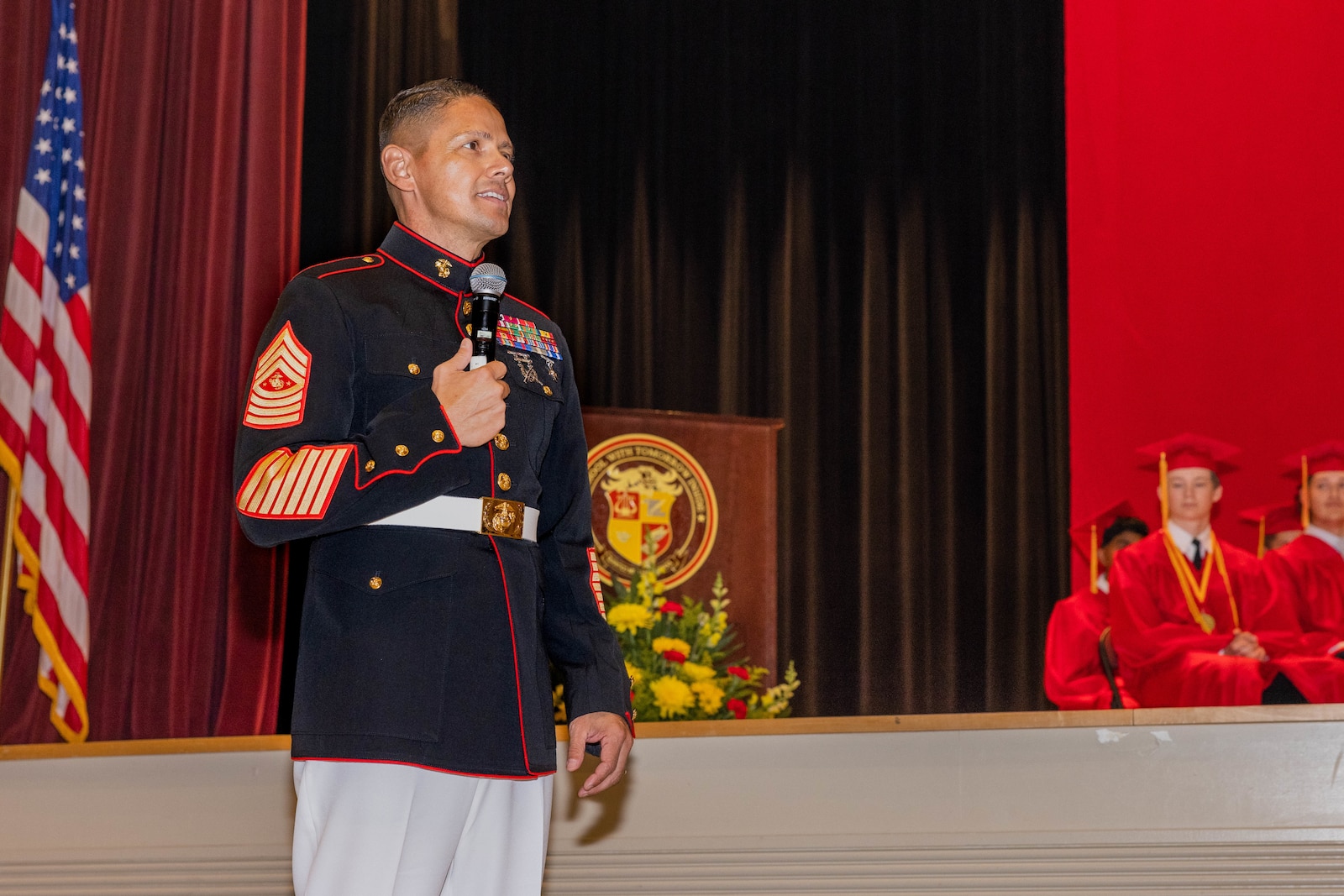 U.S. Marine Corps Sgt. Maj. Carlos Ruiz, sergeant major of the Marine Corps, addresses the audience at the graduation of Quantico Middle/High School class of 2025 at Little Hall on Marine Corps Base Quantico, Virginia, June 7, 2025. The Quantico Middle/High School graduation represents a major milestone in the lives of military families and their children on MCB Quantico. (U.S. Marine Corps photo by Lance Cpl. Harleigh Faulk)