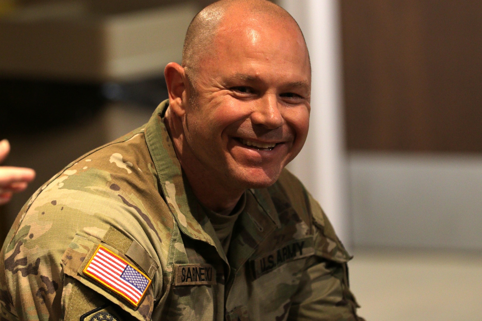 Master Sgt. Francis Sarnecki shares a laugh during remarks from Lt. Col. Allison Jacobs.