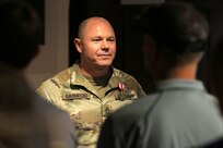 Master Sgt. Francis Sarnecki stands at attention as his retirement orders are formally read.