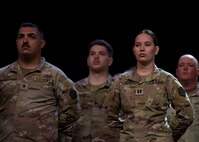 Capt. Alissa Mendez and Spc. Ethan Perry stand in formation during the Illinois Army National Guard’s 232nd Combat Sustainment Support Battalion mobilization ceremony June 7
