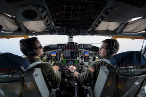 View of the flight deck of a KC-135 and two pilots