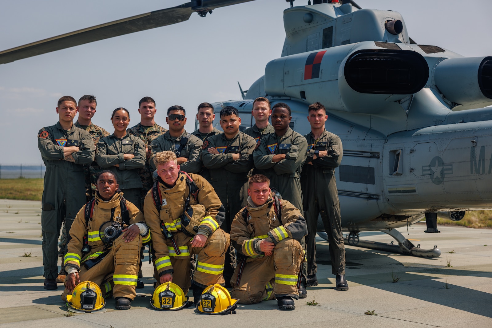 U.S. Marines with Marine Corps Air Facilities Quantico pose for a group photo after conducting a helicopter medical evacuation exercise at MCAF Quantico on Marine Corps Base Quantico, Virginia, June 4, 2025. Marines conducts training consisting of loading and unloading ordnance and helicopter medical evacuations to increase mission readiness in the event of an emergency. (U.S. Marine Corps photo by Lance Cpl. Braydon Rogers)