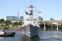PORTLAND, OREGON (June 3, 2025) – The Arleigh Burke-class guided missile destroyer USS Mustin (DDG 89) arrives for Portland Fleet Week during the 118th Rose Festival, June 3, 2025.  Portland Fleet Week is a time-honored celebration of the sea services and provides an opportunity for the citizens of Oregon to meet Sailors, Marines and Coast Guardsmen, as well as witness firsthand the latest capabilities of today’s maritime services. (U.S. Navy Photo by Mass Communication Specialist 2nd Class Kassandra Alanis)