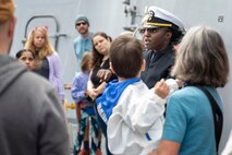 PORTLAND, OREGON (June 5, 2025) – Lt. j.g. Tarayaez Raphael, assigned to the Arleigh Burke-class guided missile destroyer USS Mustin (DDG 89), speaks to tour guests during Portland Fleet Week as part of the 118th Rose Festival, June 5, 2025.  Portland Fleet Week is a time-honored celebration of the sea services and provides an opportunity for the citizens of Oregon to meet Sailors, Marines and Coast Guardsmen, as well as witness firsthand the latest capabilities of today’s maritime services. (U.S. Navy Photo by Mass Communication Specialist Seaman Jordan Steis)