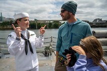 PORTLAND, OREGON (June 5, 2025) – Sonar Technician 3rd Class Jayden Meek, assigned to the Arleigh Burke-class guided missile destroyer USS Mustin (DDG 89), speaks to guests on a ship tour during Portland Fleet Week as part of the 118th Rose Festival, June 5, 2025. Portland Fleet Week is a time-honored celebration of the sea services and provides an opportunity for the citizens of Oregon to meet Sailors, Marines and Coast Guardsmen, as well as witness firsthand the latest capabilities of today’s maritime services. (U.S. Navy Photo by Mass Communication Specialist Seaman Jordan Steis)