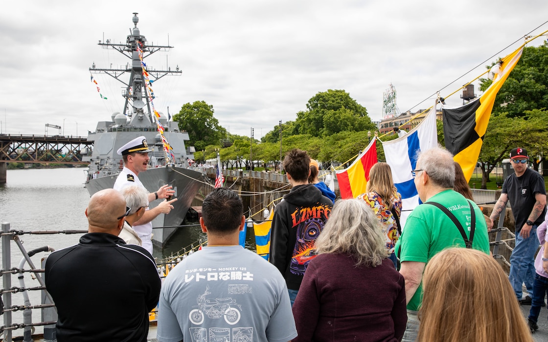 PORTLAND, OREGON (June 5, 2025) – U.S. Navy Ensign David George leads guests on a ship tour aboard the Arleigh Burke-class guided missile destroyer USS Mustin (DDG 89) during Portland Fleet Week, June 5, 2025. Portland Fleet Week is a time-honored celebration of the sea services and provides an opportunity for the citizens of Oregon to meet Sailors, Marines and Coast Guardsmen, as well as witness firsthand the latest capabilities of today’s maritime services. (U.S. Navy Photo by Mass Communication Specialist 2nd Class John A. Miller)