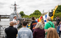 PORTLAND, OREGON (June 5, 2025) – U.S. Navy Ensign David George leads guests on a ship tour aboard the Arleigh Burke-class guided missile destroyer USS Mustin (DDG 89) during Portland Fleet Week, June 5, 2025. Portland Fleet Week is a time-honored celebration of the sea services and provides an opportunity for the citizens of Oregon to meet Sailors, Marines and Coast Guardsmen, as well as witness firsthand the latest capabilities of today’s maritime services. (U.S. Navy Photo by Mass Communication Specialist 2nd Class John A. Miller)