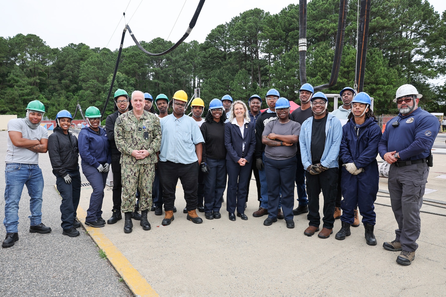 Rep. Jen Kiggans poses with a group of students at Military Sealift Command’s (MSC) Underway Replenishment Center (MUTC), at Joint Expeditionary Base Little Creek in Virginia Beach, Virginia. Kiggans observed the students during an exercise for the Standard Tensioned Replenishment Alongside Method (STREAM) training course, which provides underway replenishment training for more than 600 Civil Service Mariners each year.