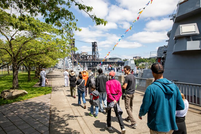 PORTLAND, OREGON (June 5, 2025) – Guests are given ship tours aboard the Arleigh Burke-class guided missile destroyer USS Jack H. Lucas (DDG 125), right, and the Arleigh Burke-class guided missile destroyer USS Mustin (DDG 89), left, during Portland Fleet Week, June 5, 2025. Portland Fleet Week is a time-honored celebration of the sea services and provides an opportunity for the citizens of Oregon to meet Sailors, Marines and Coast Guardsmen, as well as witness firsthand the latest capabilities of today’s maritime services. (U.S. Navy Photo by Mass Communication Specialist 2nd Class John A. Miller)