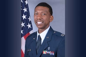 Official photo of Chaplian Darian Cornelius in front of U.S. Flag