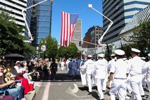 U.S. Navy Sailors march in the Grand Floral Parade during the annual Portland Fleet Week and Rose Festival in Portland, Oregon June 7, 2025. Portland Fleet Week is a time-honored celebration of the sea services and provides an opportunity for the citizens of Oregon to meet Sailors, Marines and Coast Guardsmen, as well as witness firsthand the latest capabilities of today’s maritime services. (U.S. Navy Photo by Mass Communication Specialist 2nd Class Kassandra Alanis)
