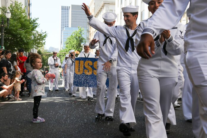 U.S. Navy Sailors march in the Grand Floral Parade during the annual Portland Fleet Week and Rose Festival in Portland, Oregon June 7, 2025. Portland Fleet Week is a time-honored celebration of the sea services and provides an opportunity for the citizens of Oregon to meet Sailors, Marines and Coast Guardsmen, as well as witness firsthand the latest capabilities of today’s maritime services. (U.S. Navy Photo by Mass Communication Specialist 2nd Class Kassandra Alanis)