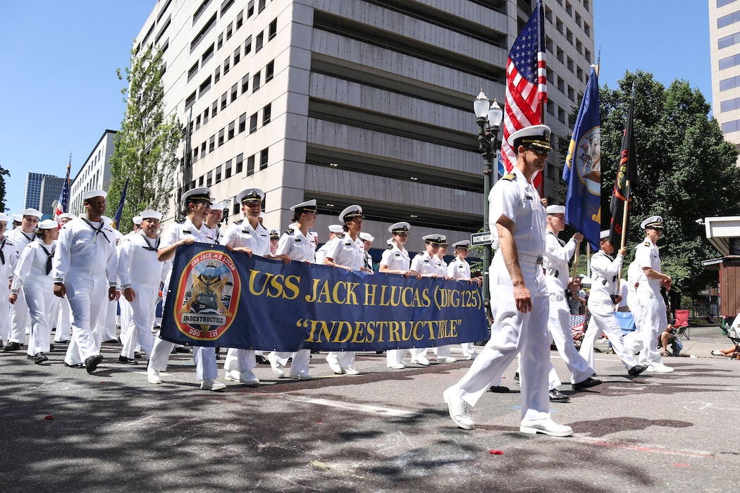 U.S. Navy Sailors march in the Grand Floral Parade during the annual Portland Fleet Week and Rose Festival in Portland, Oregon June 7, 2025. Portland Fleet Week is a time-honored celebration of the sea services and provides an opportunity for the citizens of Oregon to meet Sailors, Marines and Coast Guardsmen, as well as witness firsthand the latest capabilities of today’s maritime services. (U.S. Navy Photo by Mass Communication Specialist 2nd Class Kassandra Alanis)
