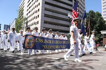 U.S. Navy Sailors march in the Grand Floral Parade during the annual Portland Fleet Week and Rose Festival in Portland, Oregon June 7, 2025. Portland Fleet Week is a time-honored celebration of the sea services and provides an opportunity for the citizens of Oregon to meet Sailors, Marines and Coast Guardsmen, as well as witness firsthand the latest capabilities of today’s maritime services. (U.S. Navy Photo by Mass Communication Specialist 2nd Class Kassandra Alanis)