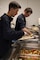 PORTLAND, OREGON (June 7, 2025) – U.S. Navy Boatswain's Mate Gaven Uonites, front, and Electronics Technician 3rd Class Cyrus Vanhoek volunteer during a dinner service at the Burnside Shelter (Portland Rescue Mission) during Portland Fleet Week during the 118th Rose Festival, June 7, 2025. Portland Fleet Week is a time-honored celebration of the sea services and provides an opportunity for the citizens of Oregon to meet Sailors, Marines and Coast Guardsmen, as well as witness firsthand the latest capabilities of today’s maritime services. (U.S. Navy Photo by Mass Communication Specialist 2nd Class Kassandra Alanis)