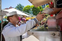PORTLAND, OREGON (June 7, 2025) – A Sailor orders lunch from a food truck at Midtown Beer Garden during Portland Fleet Week, June 7, 2025. Portland Fleet Week is a time-honored celebration of the sea services and provides an opportunity for the citizens of Oregon to meet Sailors, Marines and Coast Guardsmen, as well as witness firsthand the latest capabilities of today’s maritime services. (U.S. Navy Photo by Mass Communication Specialist 2nd Class John A. Miller)