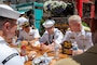 PORTLAND, OREGON (June 7, 2025) – U.S. Navy Vice Adm. John Wade, commander, U.S. 3rd Fleet, right, speaks with Sailors and Marines while having lunch at Midtown Beer Garden during Portland Fleet Week, June 7, 2025. Portland Fleet Week is a time-honored celebration of the sea services and provides an opportunity for the citizens of Oregon to meet Sailors, Marines and Coast Guardsmen, as well as witness firsthand the latest capabilities of today’s maritime services. (U.S. Navy Photo by Mass Communication Specialist 2nd Class John A. Miller)