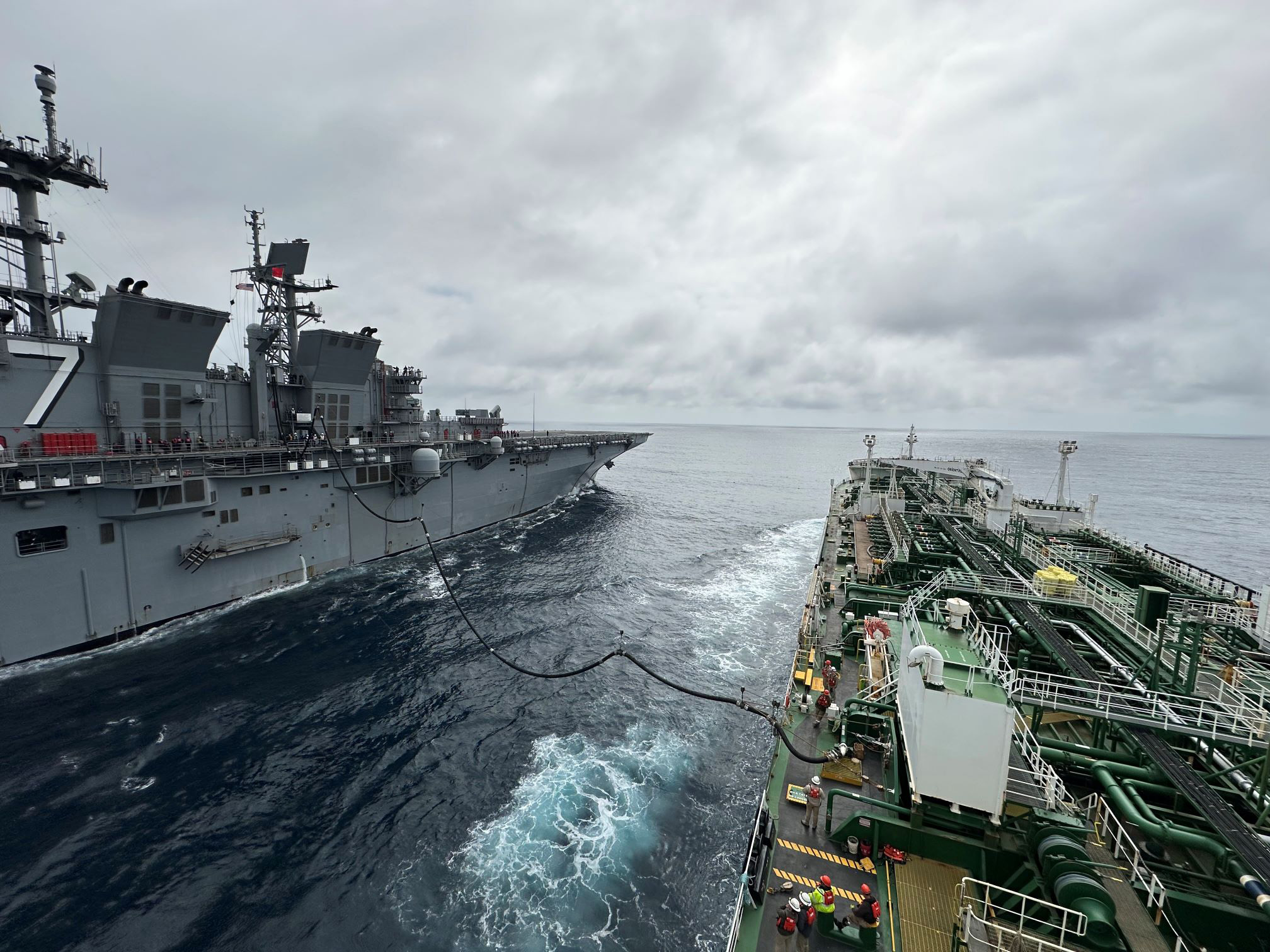 Military Sealift Command’s chartered Motor Tanker Ship Empire State and U.S. Navy amphibious assault ship USS Tripoli (LPH-10) conduct the first Consolidated Replenishment at Sea (CONSOL) between Tripoli and a tanker ship.