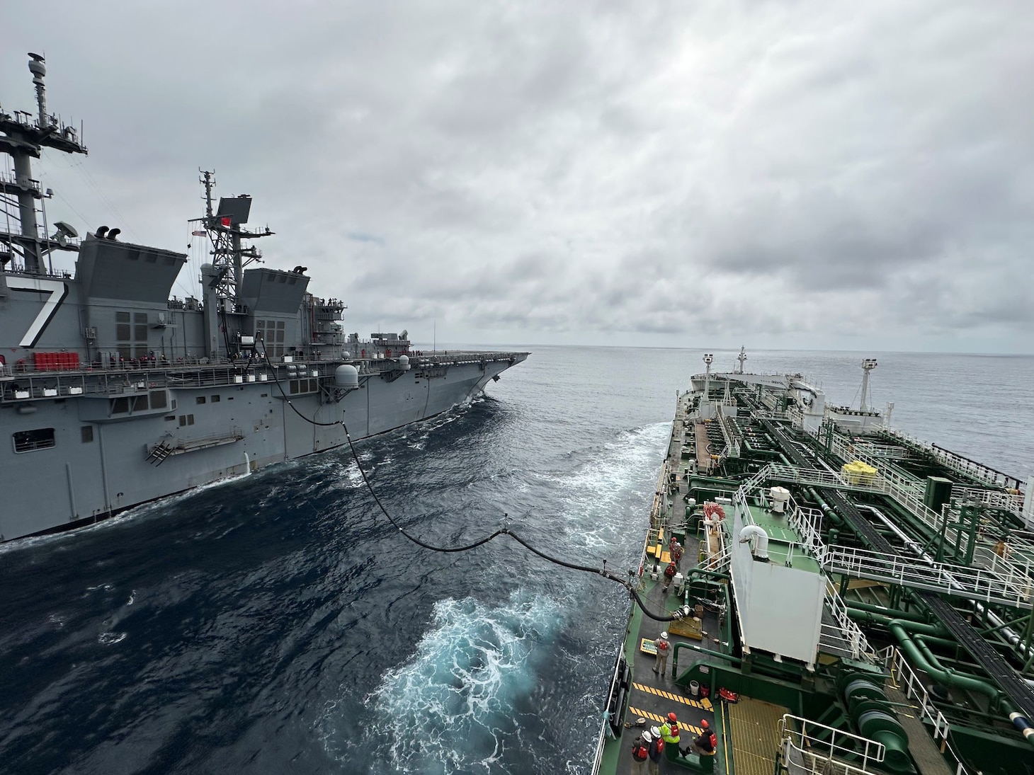 Military Sealift Command’s chartered Motor Tanker Ship Empire State and U.S. Navy amphibious assault ship USS Tripoli (LPH-10) conduct the first Consolidated Replenishment at Sea (CONSOL) between Tripoli and a tanker ship.