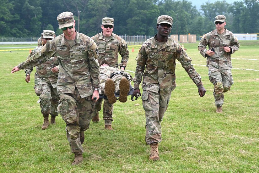 Members of the District of Columbia Army National Guard participate in the O’Neill Competition at Fort Indiantown Gap, PA, on June 6, 2025. The event pushed more than 250 participants through a grueling day of military fundamentals—from ruck marches and weapons qualification to medical tasks and vehicle maintenance—designed to unify and strengthen the Warrior Ethos. The competition was a tribute to D-Day (Operation Overlord) and the legacy of LTC John C. O’Neill, a World War II combat engineer and D.C. Guardsman who helped breach enemy defenses on Omaha Beach in 1944. (U.S. Army National Guard photo by Master Sgt. Arthur M. Wright)