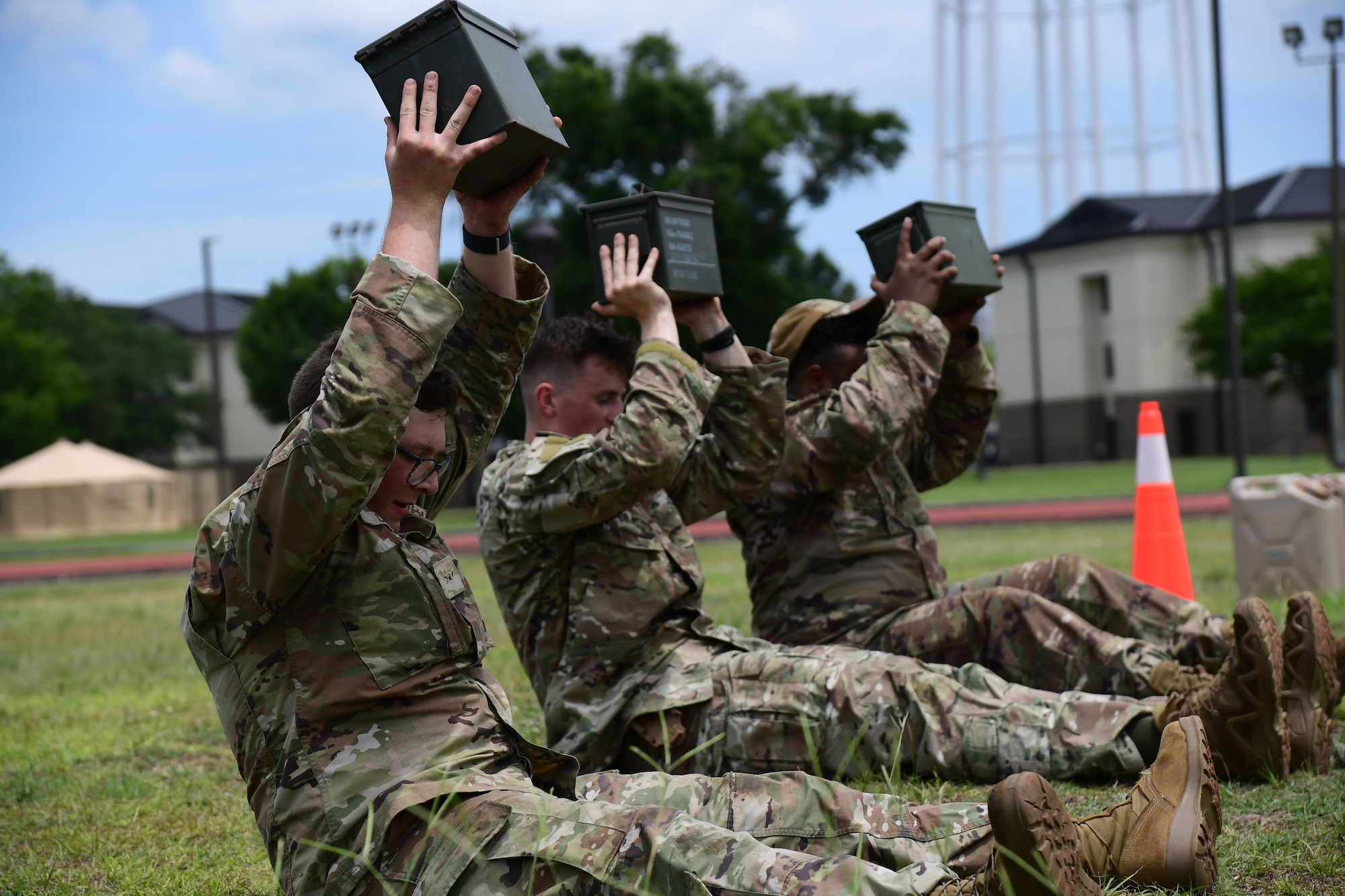 Service members participate in combat agility drills during Warrior Day