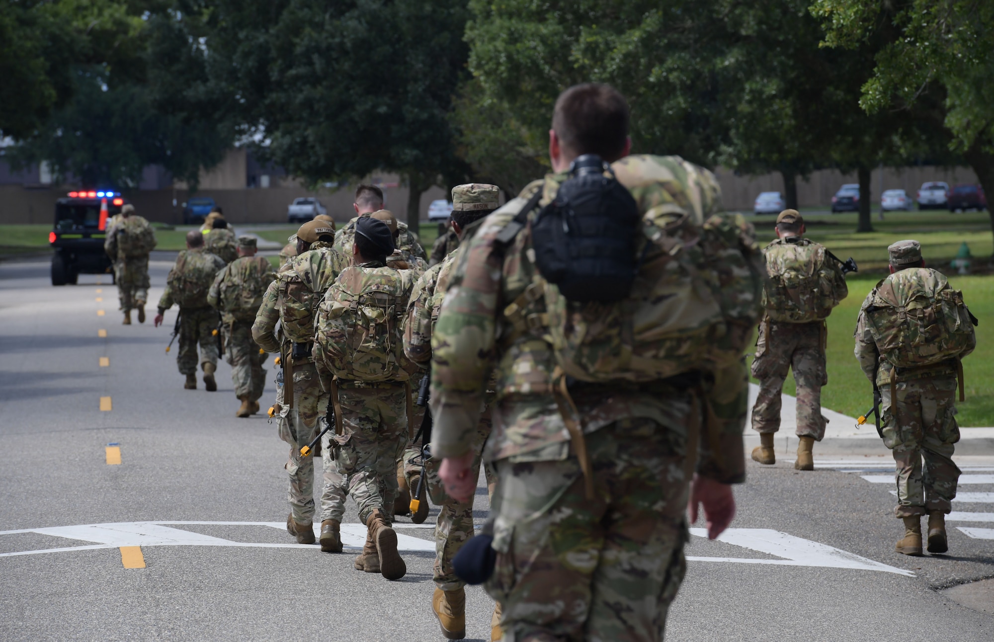 Service members ruck around base during Warrior Day