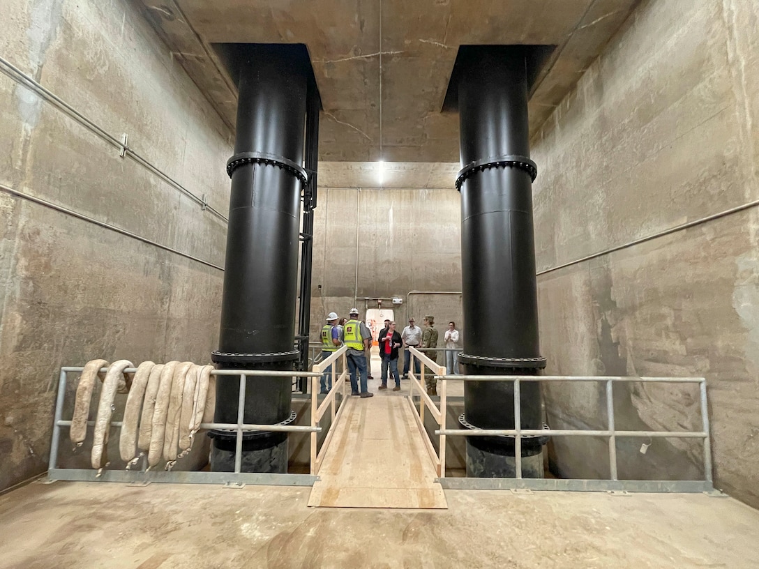 Project Manager Jairus Stroupe and his outstanding DD17 Pumping Plane Engine Replacement Project Delivery Team recently reached the Project Completion milestone with our partners, Drainage District 17 of Mississippi County, Arkansas, and contractor A&H-Ambica JV, LLC. 

This very important $5.1M project replaced all three DD17 Pumping Plant engines. The DD17 Pumping Plant, located near Blytheville, Arkansas, serves to pump rainwater over the St. Francis levee system during periods of flooding. This pumping plant is part of the broader efforts by the Memphis District to manage water levels and prevent flood damage in the area.

The 700 cubic feet per second Pumping Plant, within the St. Francis Basin, protects over 30 square miles in Mississippi County, Arkansas.  The original Waukesha engines that were replaced had been in service since the plant started operation in 1981.  Engine replacement was critical since Waukesha engines are obsolete with replacement parts unavailable.  The engines were replaced with modern 1,000 horsepower Caterpillar engines.