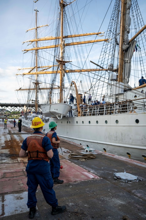 PORTLAND, OREGON (June 4, 2025) –  United States Coast Guardsmen conduct line handling operations for USCG Cutter Eagle (WIX 327) during their arrival for Portland Fleet Week as part of the 118th Rose Festival, June 4, 2025. Portland Fleet Week is a time-honored celebration of the sea services and provides an opportunity for the citizens of Oregon to meet Sailors, Marines and Coast Guardsmen, as well as witness firsthand the latest capabilities of today’s maritime services. (U.S. Navy Photo by Mass Communication Specialist Seaman Jordan Steis)