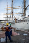 PORTLAND, OREGON (June 4, 2025) –  United States Coast Guardsmen conduct line handling operations for USCG Cutter Eagle (WIX 327) during their arrival for Portland Fleet Week as part of the 118th Rose Festival, June 4, 2025. Portland Fleet Week is a time-honored celebration of the sea services and provides an opportunity for the citizens of Oregon to meet Sailors, Marines and Coast Guardsmen, as well as witness firsthand the latest capabilities of today’s maritime services. (U.S. Navy Photo by Mass Communication Specialist Seaman Jordan Steis)