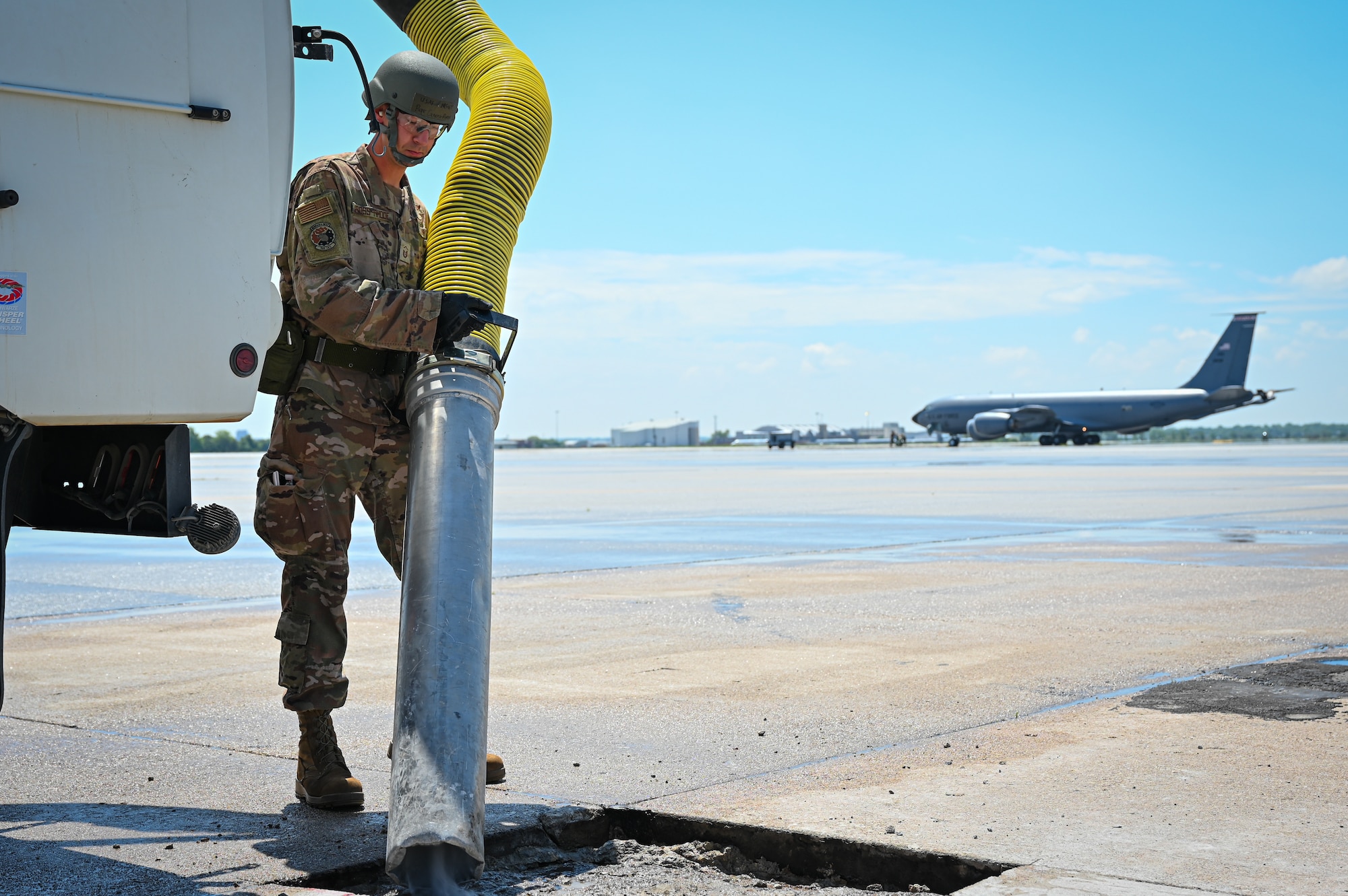 Master Sgt. Peter Gross-Rhode, 155th Civil Engineering Squadron, cleans a hole with debris during a Combat Readiness Exercise at the Nebraska National Guard air base in Lincoln, Nebraska, June 7 2025.