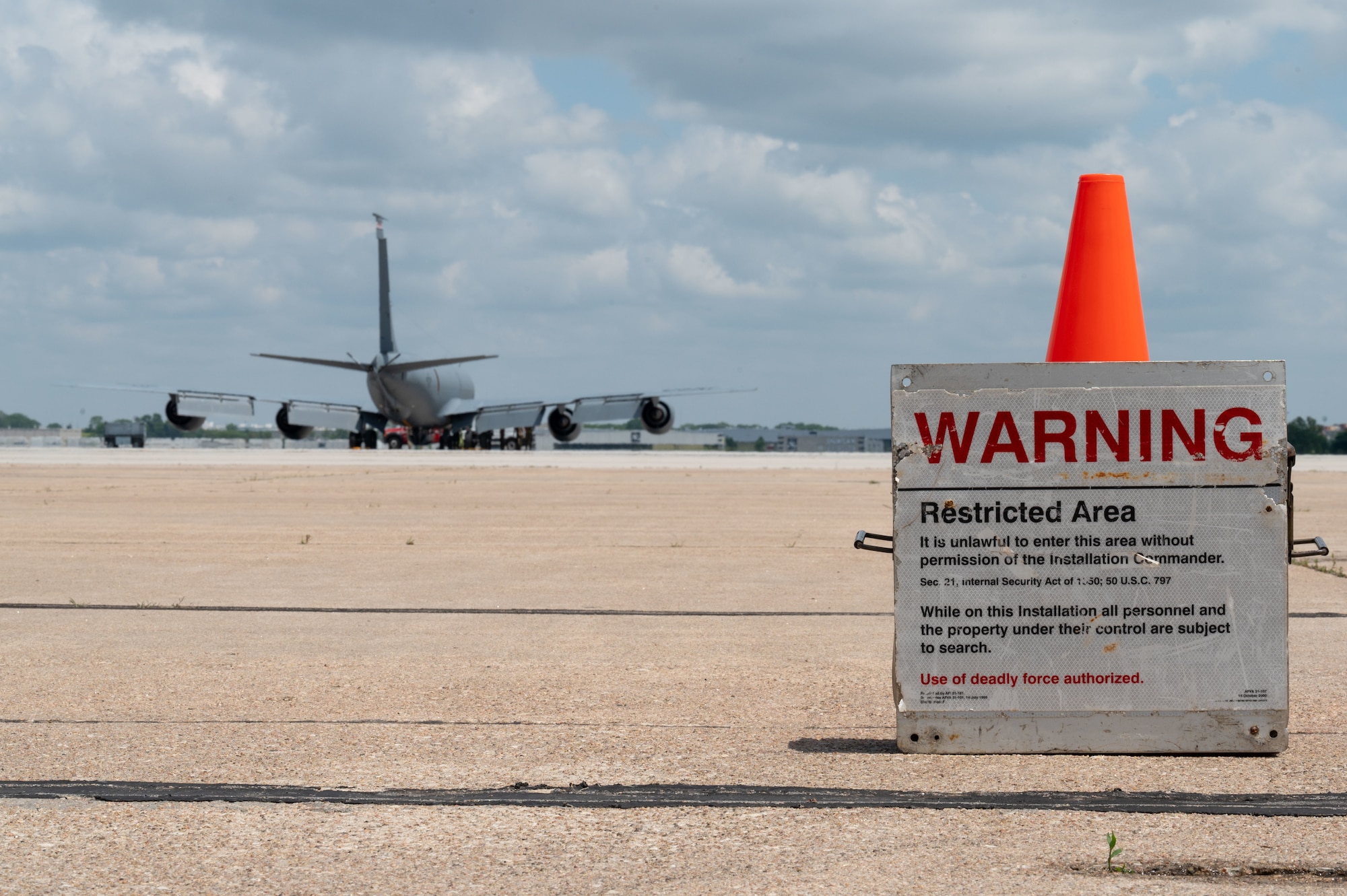 A restricted area signs marks the entrance to where Airmen assigned to the 155th Air Refueling Wing, are conducting pre-flight inspections on a KC-135 Stratotanker, at the Nebraska National Guard air base in Lincoln, Nebraska, June 6, 2025.