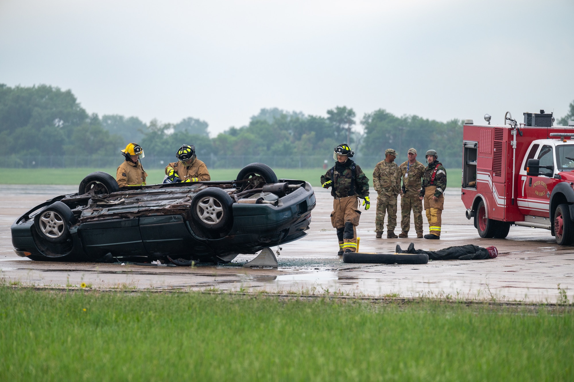 Firefighters with the 155th Air Refueling Wing simulate a motor vehicle extraction during a Combat Readiness Exercise, June 7, 2025, at the Nebraska National Guard air base in Lincoln, Nebraska.
