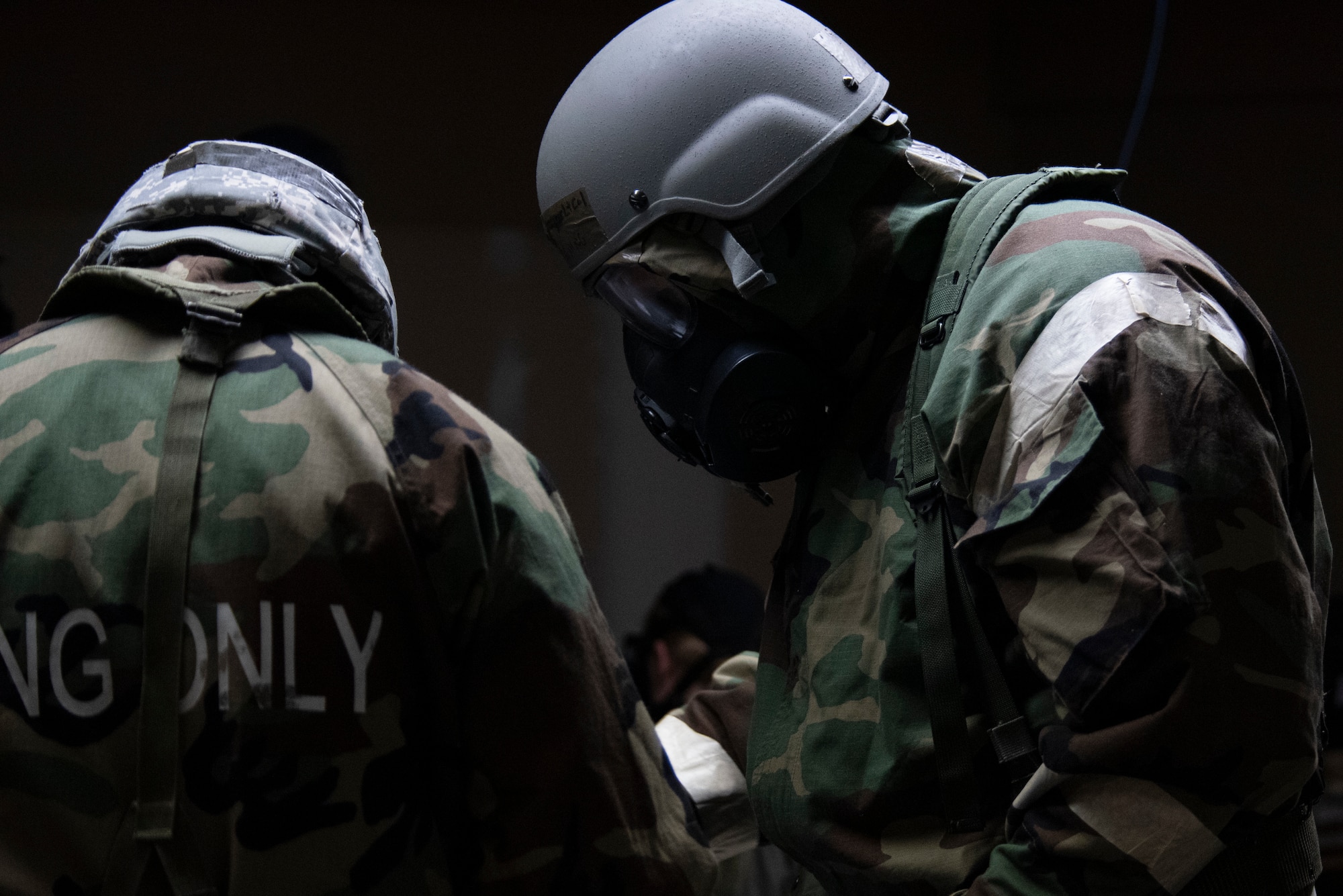 155th Air Refueling Wing Airmen navigate the challenges of wearing chemical protective gear while performing their normal jobs during a Combat Readiness Exercise, June 7, 2025, at the Nebraska National Guard air base in Lincoln, Nebraska.