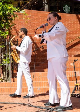 PORTLAND, OREGON (June 6, 2025) – U.S. Navy Musician 2nd Class Elizabeth Wetzel, vocals, and Musician 3rd Class Jared Goodrum, saxophone, assigned to Navy Band Northwest “Protocol Combo,” perform at Pioneer Courthouse Square during Portland Fleet Week, June 6, 2025. Portland Fleet Week is a time-honored celebration of the sea services and provides an opportunity for the citizens of Oregon to meet Sailors, Marines and Coast Guardsmen, as well as witness firsthand the latest capabilities of today’s maritime services. (U.S. Navy Photo by Mass Communication Specialist 2nd Class John A. Miller)