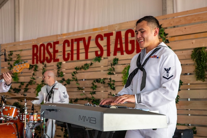 PORTLAND, OREGON (June 6, 2025) – U.S. Navy Musician 3rd Class Jermilino San Pedro, assigned to Navy Band Northwest “Protocol Combo,” plays the keys at Portland City Fair during Portland Fleet Week, June 6, 2025. Portland Fleet Week is a time-honored celebration of the sea services and provides an opportunity for the citizens of Oregon to meet Sailors, Marines and Coast Guardsmen, as well as witness firsthand the latest capabilities of today’s maritime services. (U.S. Navy Photo by Mass Communication Specialist 2nd Class John A. Miller)