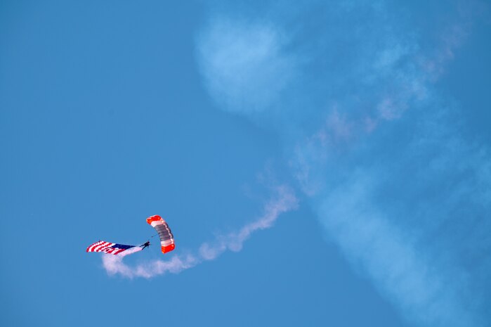 Parachutist Cory Christiansen descends with a large American flag in a parachute demonstration to open the Beale Air & Space Expo at Beale Air Force Base, California, June 7, 2025.