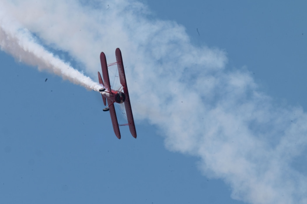 Vickey Benzing in her 1940 Boeing Stearman biplane performs aerobatics during the Beale Air & Space Expo at Beale Air Force Base, California, June 7, 2025.