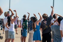 A crowd of people watch aircraft flying during the Beale Air & Space Expo at Beale Air Force Base, California, June 7, 2025.